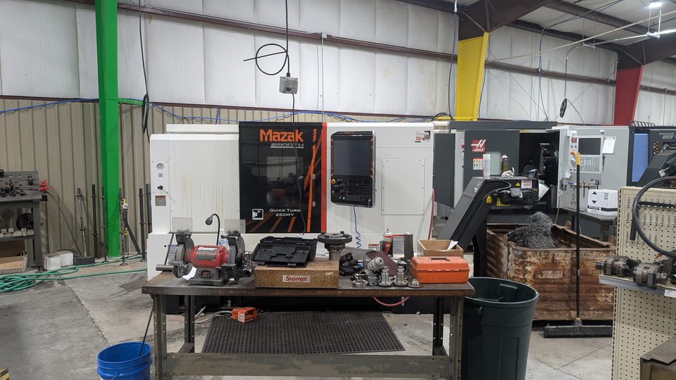 Mazak Quick Turn 250MY CNC turning center beside other machine shop equipment